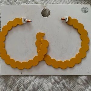 Yellow hoop earring